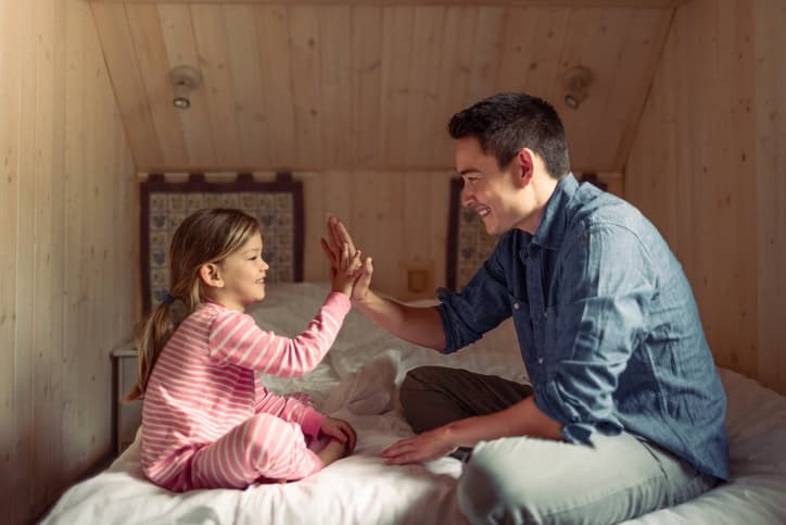Family, father and child giving high five at home, bonding, support , achievement. Parent motivating kid  congratulating, child development, encouragement concept